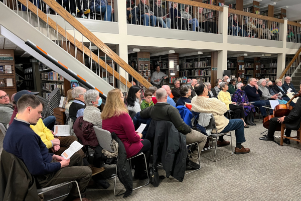 Group of people watching performance in library's Adult Reading Room