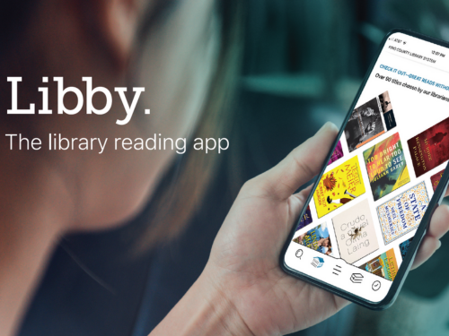 Person holding cellphone using Libby App